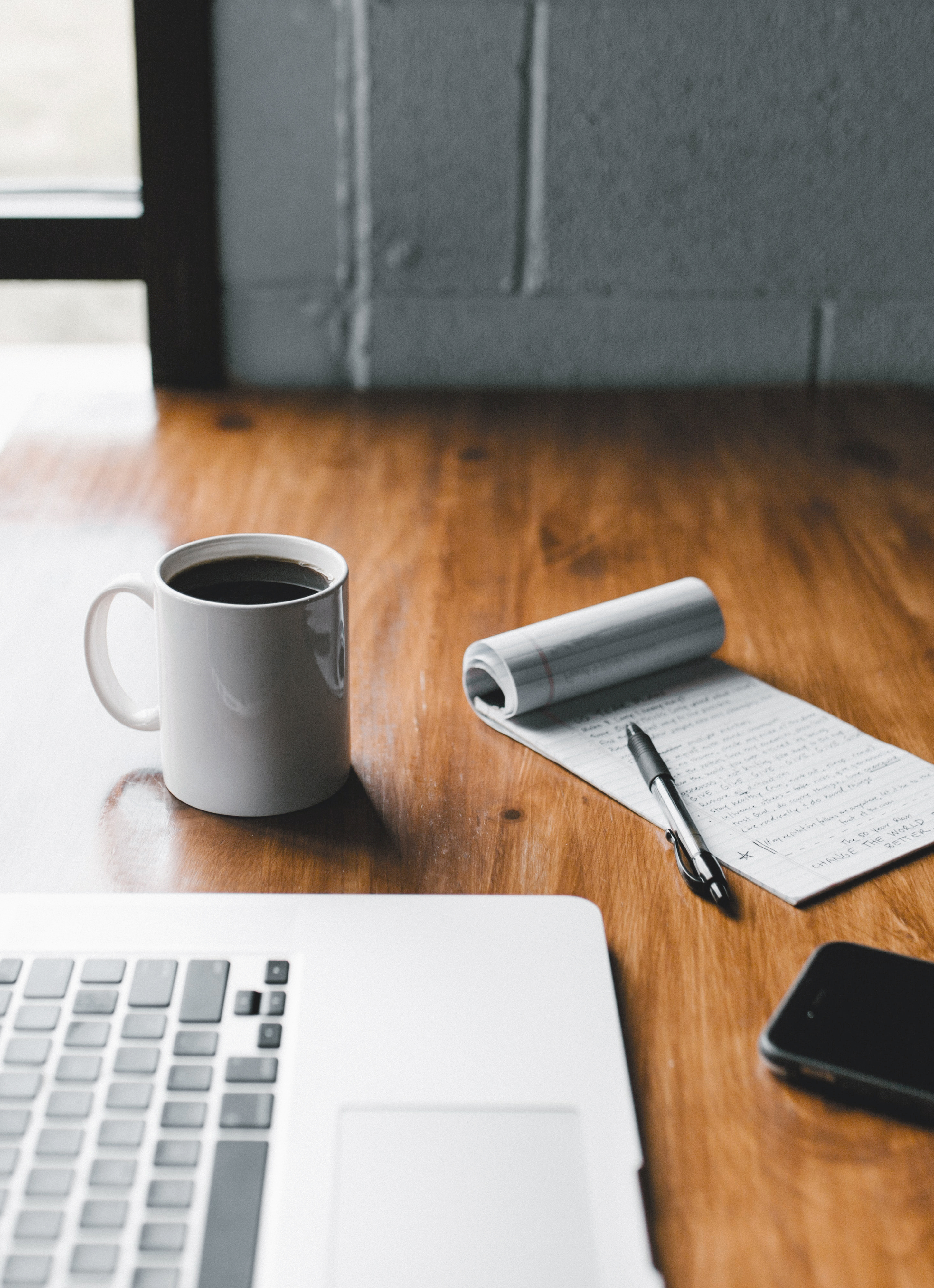 laptop, notepad, and coffee